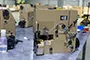 Одноигольная мешкозашивочная головка непрерывного действия с устройством обрезки крепированной ленты